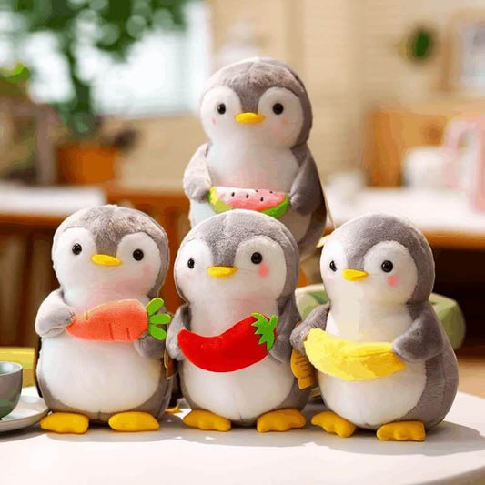 Cute penguin plushie holding fruit